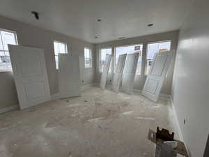 Primary bedroom with lots of windows