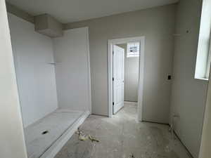 Primary bathroom with large spa shower and dual vanities