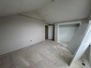 Bedroom 5 with vaulted ceiling and a closet