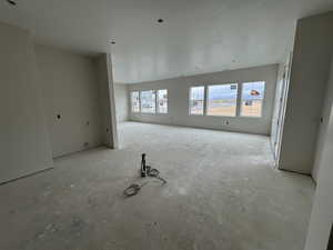 Kitchen with large island and view into dining