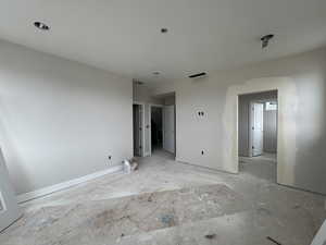 Primary bedroom with large walk-in closet and in suite bathroom