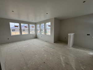 Large family room with dry bar and mountain views