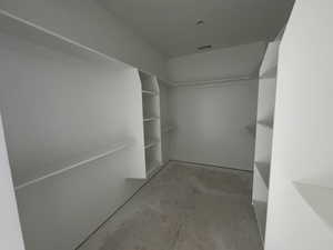 Primary bedroom walk in closet