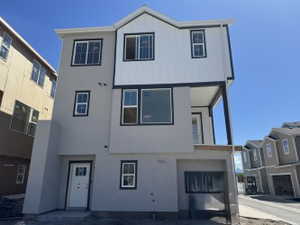 View of front facade featuring stucco siding