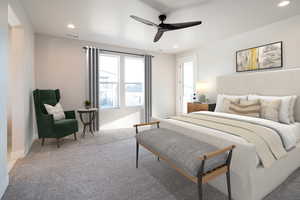 Carpeted bedroom featuring ceiling fan