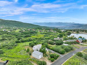 Bird's eye view with a water and mountain view