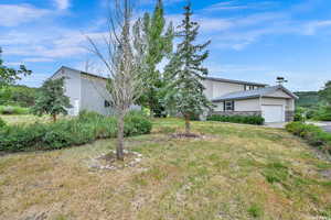 View of yard featuring a garage