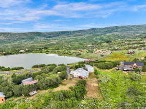 Drone / aerial view with a water and mountain view