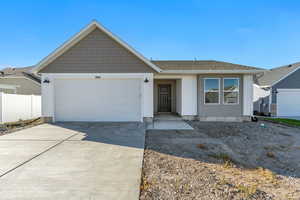 Ranch-style home featuring a garage