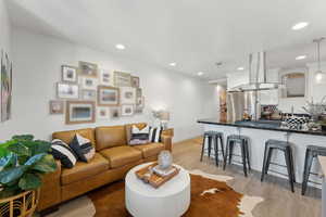 Living room with light wood-type flooring