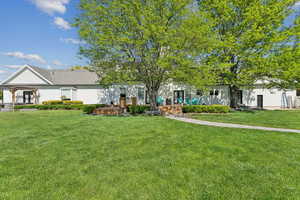 Obstructed view of property with a front yard