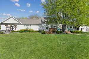 View of front of property featuring a front lawn