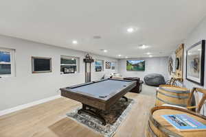 Recreation room featuring billiards and light wood-type flooring