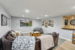 Living room with wood-type flooring