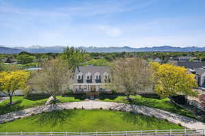 Exterior space featuring a front yard and a mountain view