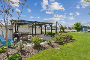 View of yard with a pergola and a patio