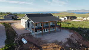 View of front of house featuring driveway and a deck with mountain view