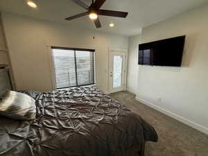 Bedroom featuring carpet, baseboards, access to outside, and recessed lighting