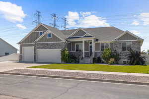 Craftsman-style home featuring a front yard