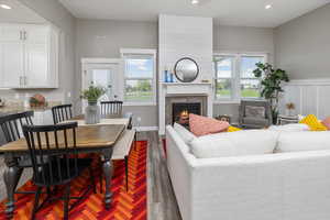 Living room with a healthy amount of sunlight and dark hardwood / wood-style flooring