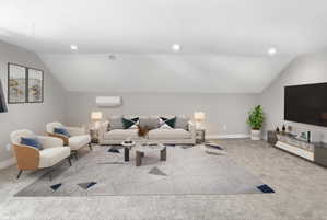 Spacious living area featuring sloped ceilings, recessed lighting, and carpeted flooring