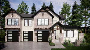 View of front of home featuring a 4 garage.