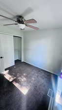 Unfurnished bedroom featuring a closet and ceiling fan