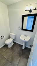 Bathroom with tile flooring and toilet