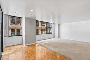 Spare room featuring light parquet flooring