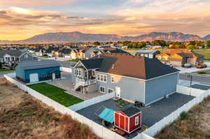 Aerial view at dusk featuring a mountain view