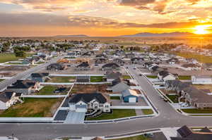 Aerial view at dusk featuring a mountain view