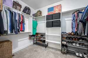 Walk in closet featuring carpet