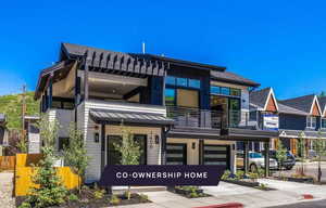 View of front of home with a balcony