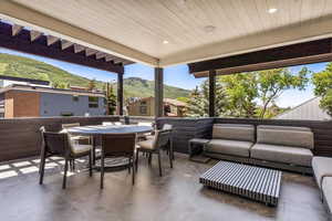 View of patio / terrace featuring an outdoor living space and a mountain view