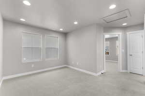 Empty room with light colored carpet