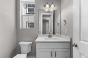 Bathroom with toilet and vanity