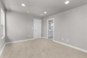 Empty room with sink and light colored carpet