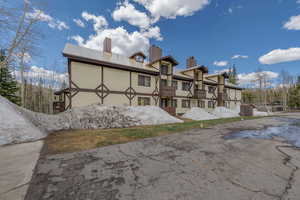 Back of house with a balcony