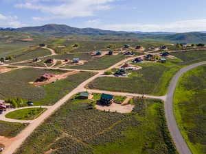 Birds eye view of property featuring a rural view and a mountain view