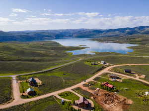 Bird's eye view featuring a water and mountain view