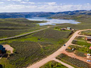 Aerial view featuring a water and mountain view