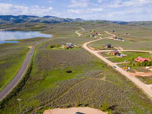 Bird's eye view with a water and mountain view and a rural view