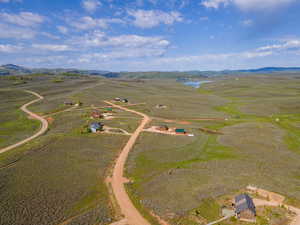 Birds eye view of property with a rural view