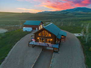 Aerial view at dusk with a mountain view and a rural view