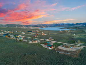 Aerial view at dusk with a rural view and a water and mountain view