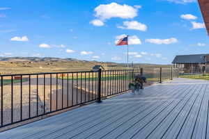 Wooden terrace featuring a mountain view