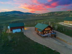 Aerial view at dusk with a rural view and a mountain view