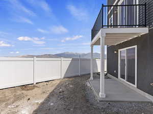 View of yard with a patio and a mountain view