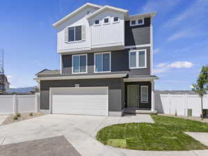 View of front facade featuring a garage