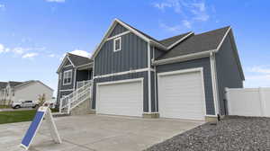 View of front facade featuring a garage